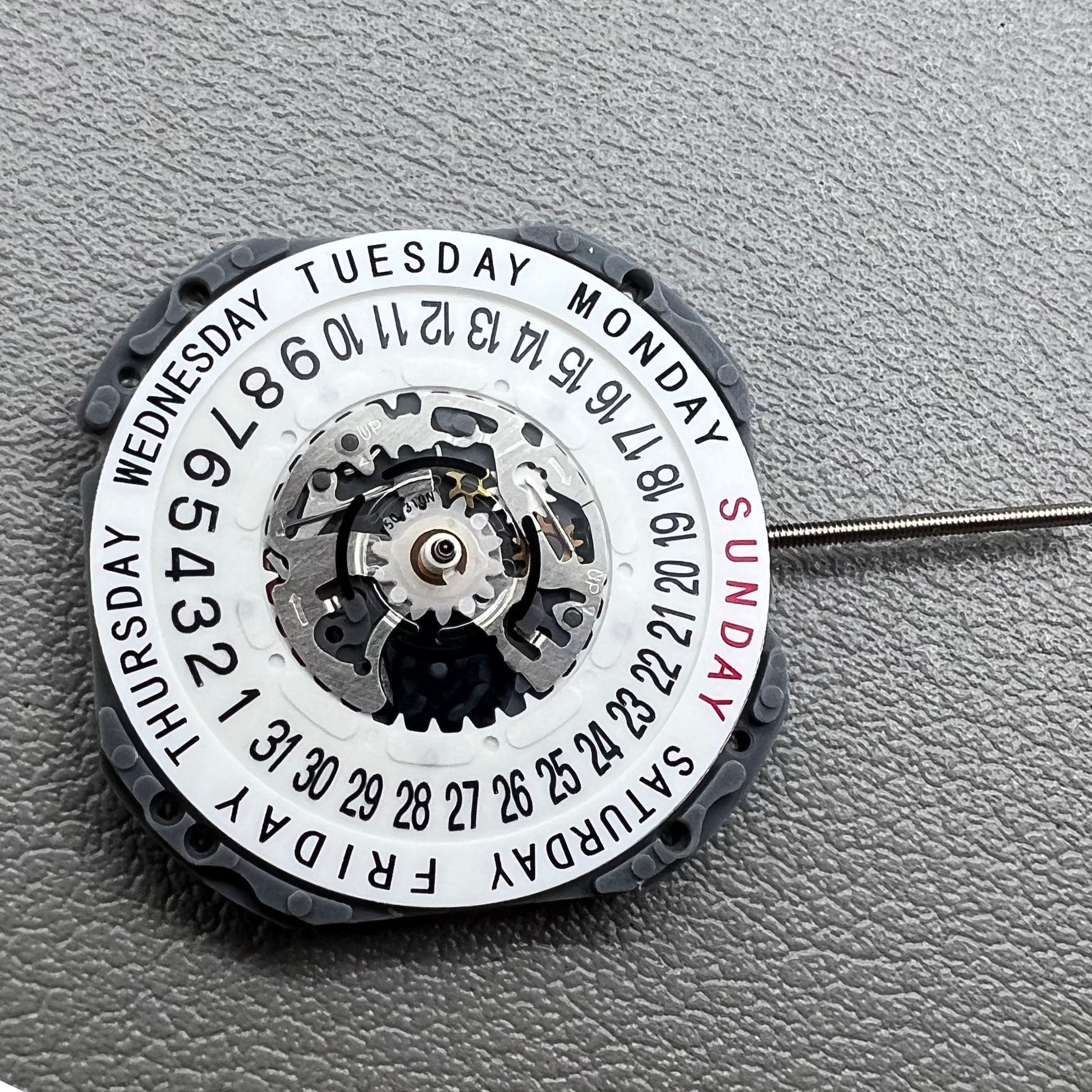 Japan Hattori Epson VJ45B quartz watch movement with date at 6 o'clock and day at 12 position.