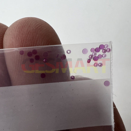 Red gemstone top cap jewels set of 100 for precise watch repair by professional watchmakers.