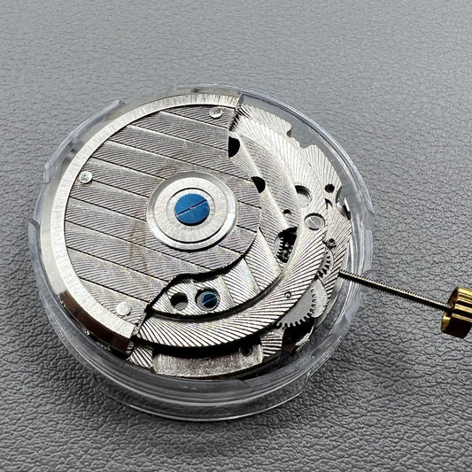 Wenzhou Mechanical watch movement with bare balance wheel and big date display at 12 o'clock.