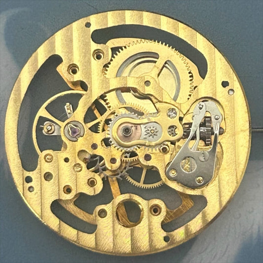 Golden hollow hand winding mechanical movement watch repair part, precision craftsmanship, China made.