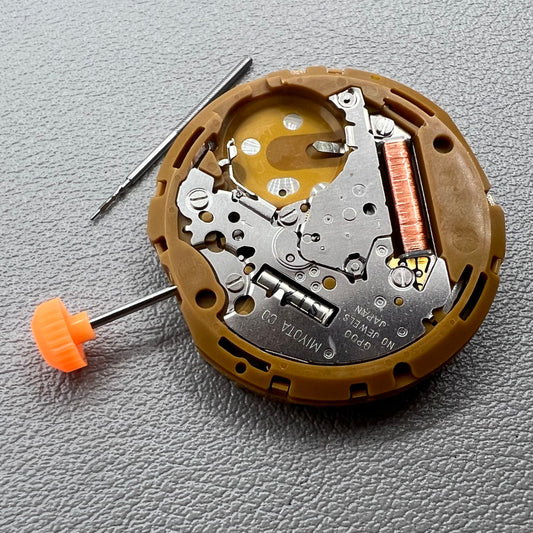 Japan Miyota GP00 quartz watch movement close-up, precision timekeeping mechanism for watches.