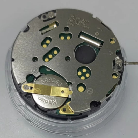Swiss Made ISA8371 quartz watch movement with date at 6 and small seconds at 3 and 9 positions.