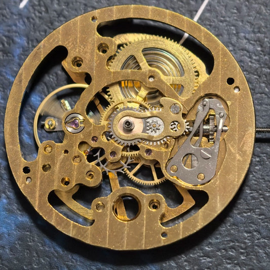 Hollow golden manual winding mechanical watch part for repair by China Made brand.