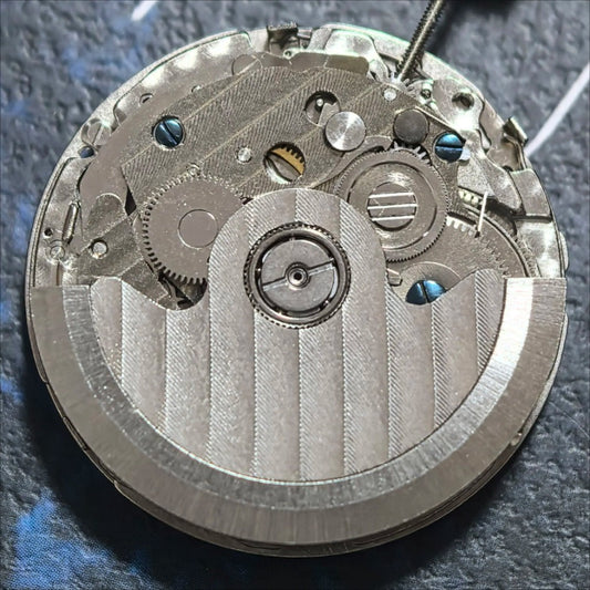 Mechanical watch part with small second at 6 and big date at 12, precision China made movement.