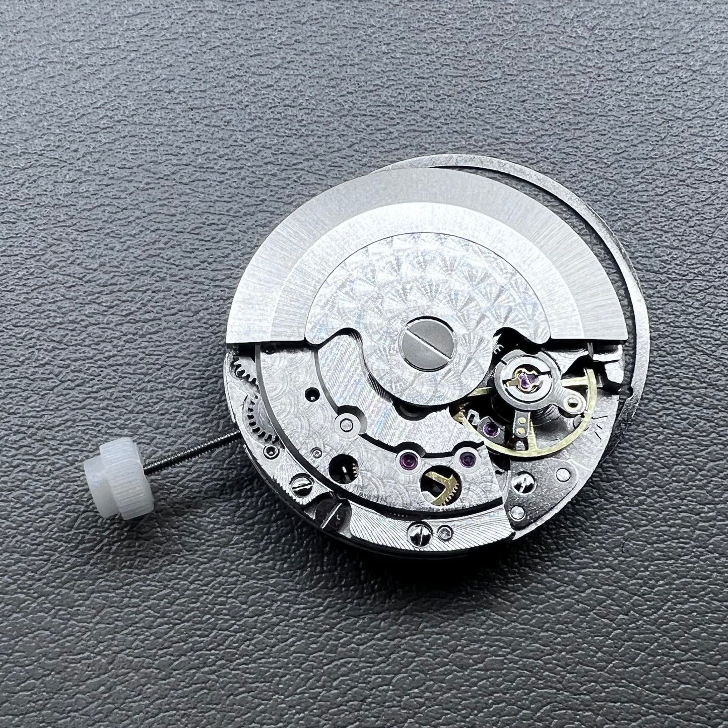 Silver plated DG2813 automatic watch movement with large and small hands, date display at 3 o'clock
