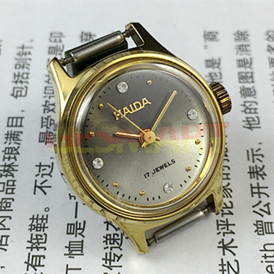 Elegant SHANGHAI HAIDA lady watch with golden case, mechanical movement, and imitation diamond markers for luxury style.