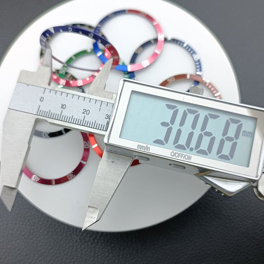 Green lume aluminum watch bezel with blue slope and white font, 36.5/30.7mm for precise timekeeping accessories.