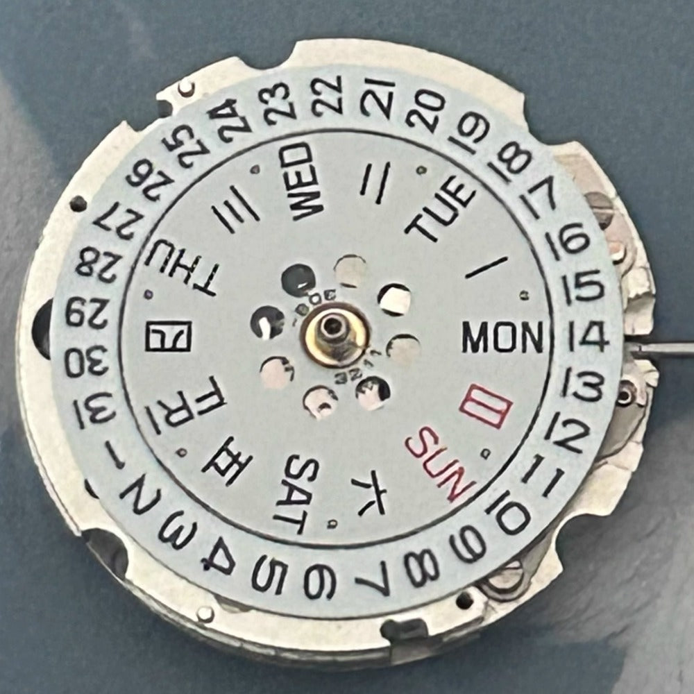 Citizen watch accessory with Japan-made 8205 mechanical movement, 3 hands, and day-date display at 3 o'clock.