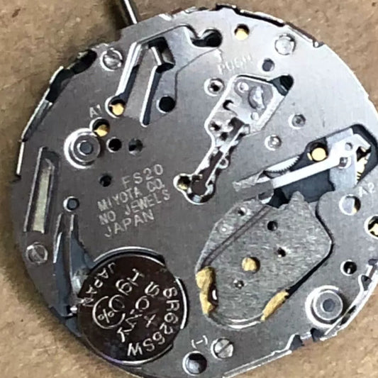 Original Japan Made FS20 quartz watch movement with single calendar date at 3 o'clock, white disk.