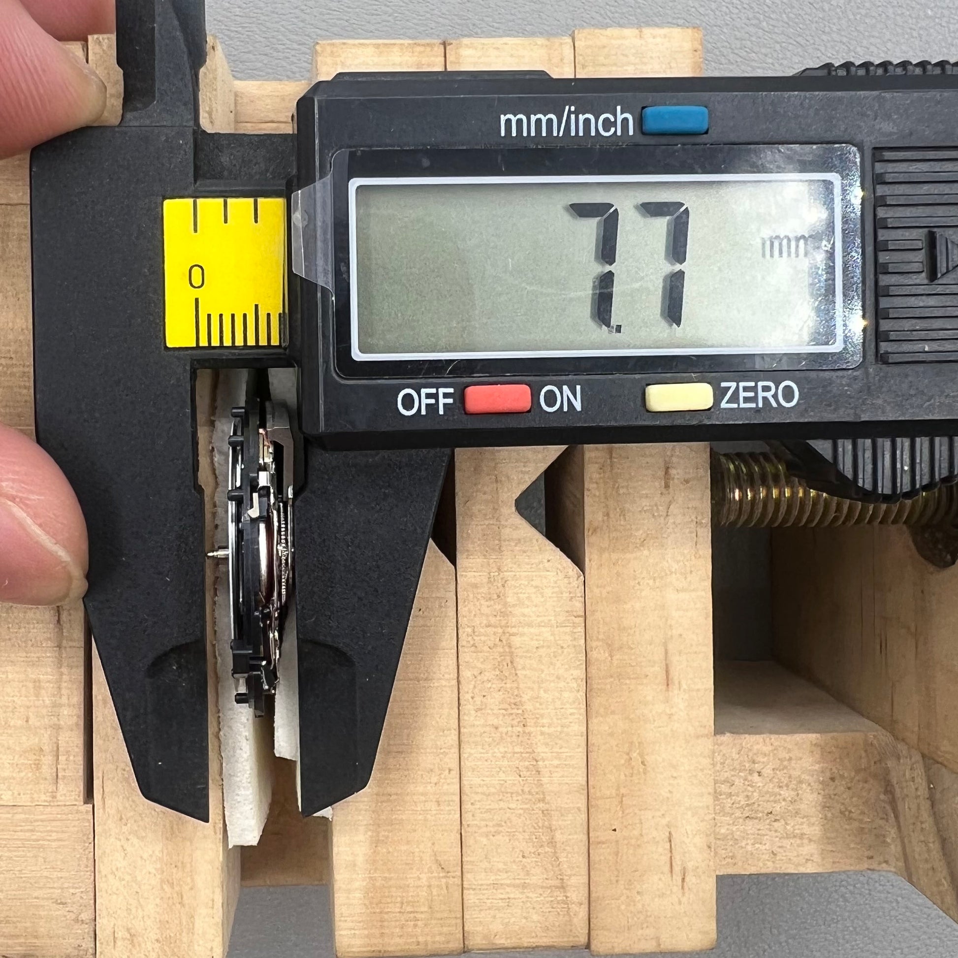 Seiko 5M85A quartz watch movement close-up, showcasing precise and durable timekeeping mechanism.