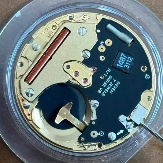 Swiss Made ETA255.483 watch movement displaying moon phase and small second at 6, precision quartz timing.