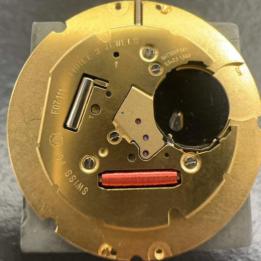 Swiss Made ETA F07.111 quartz movement watch with black dial, date at 6, precision 3-hand design.