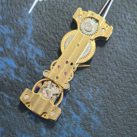 Golden long hand winding mechanical watch part by China Made, precision movement component for watch repair.
