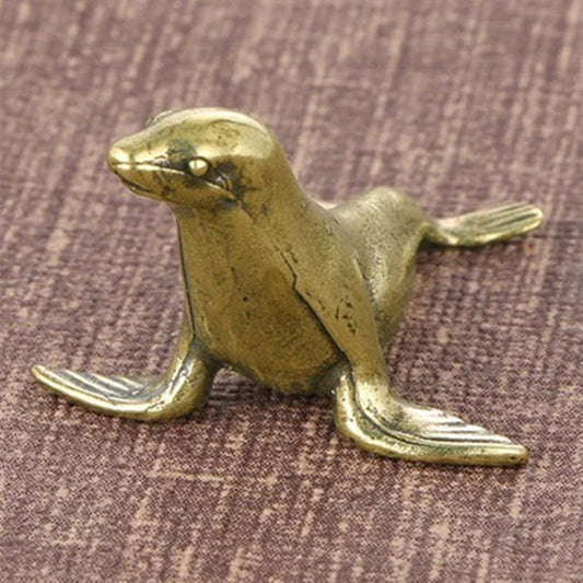 Solid copper vintage seal figurine with hand-carved details, perfect collectible trinket.