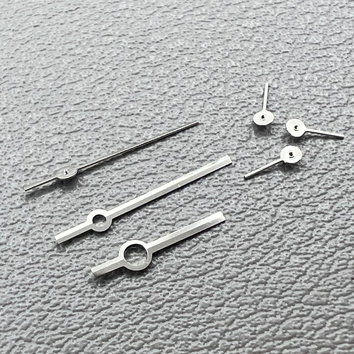 Silver watch hands set for Ronda 5030.D quartz movement, precision timepiece parts.