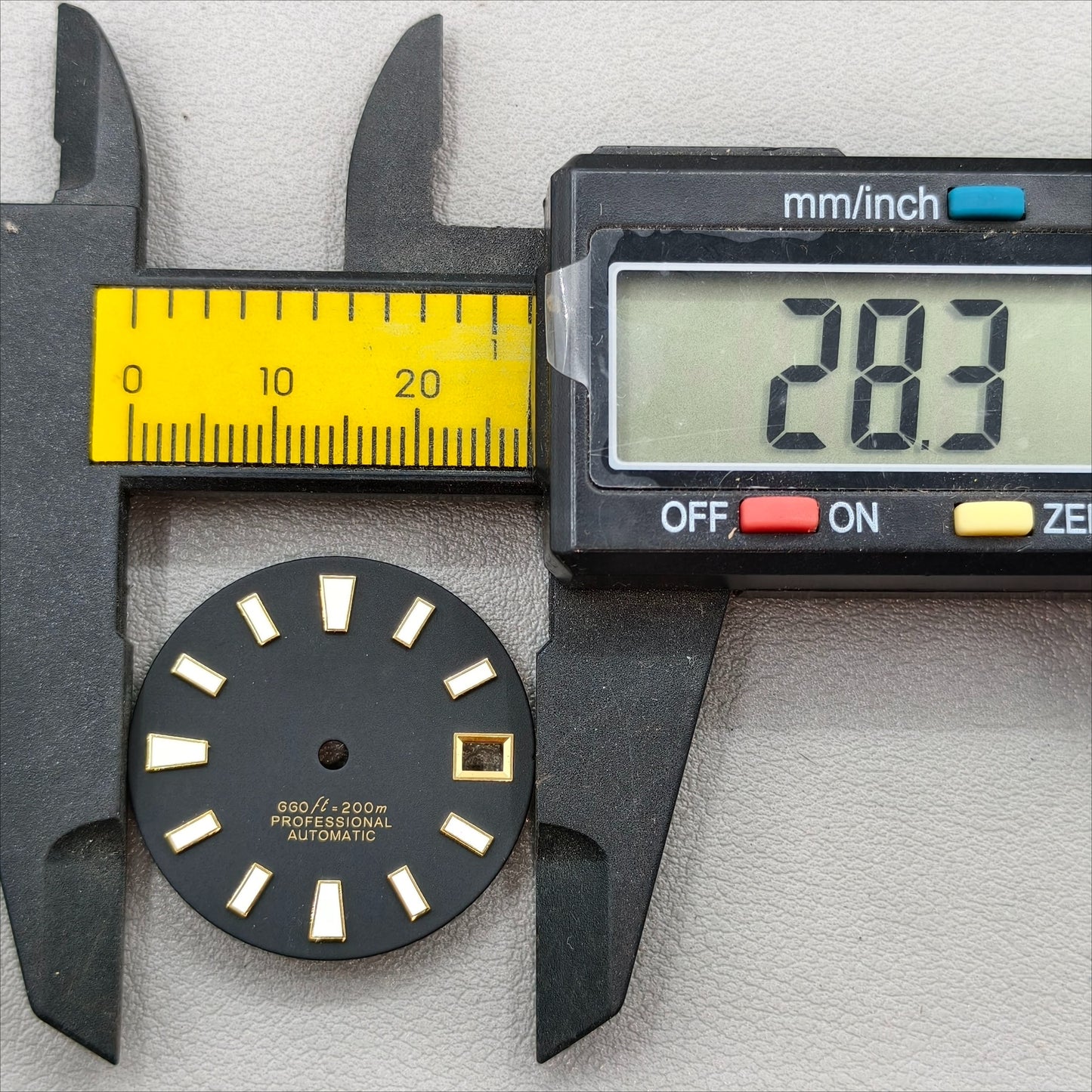 watch dial with S logo