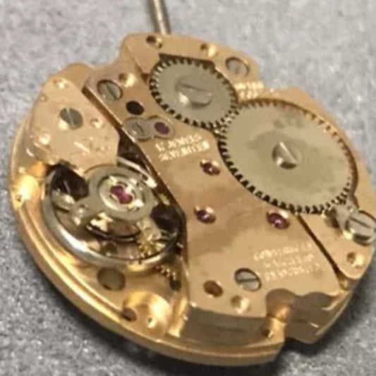 Swiss Made RONDA MATIC 9037-21 manual winding watch movement disassembled for repair.