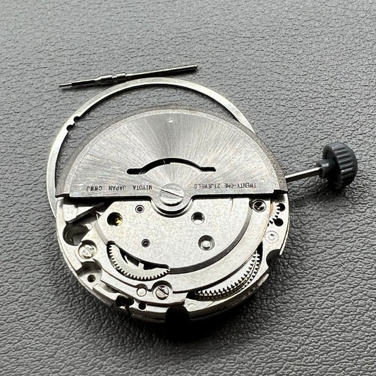 Close-up of Japan Miyota 8200 movement with single date display at 3 o'clock on watch accessory.
