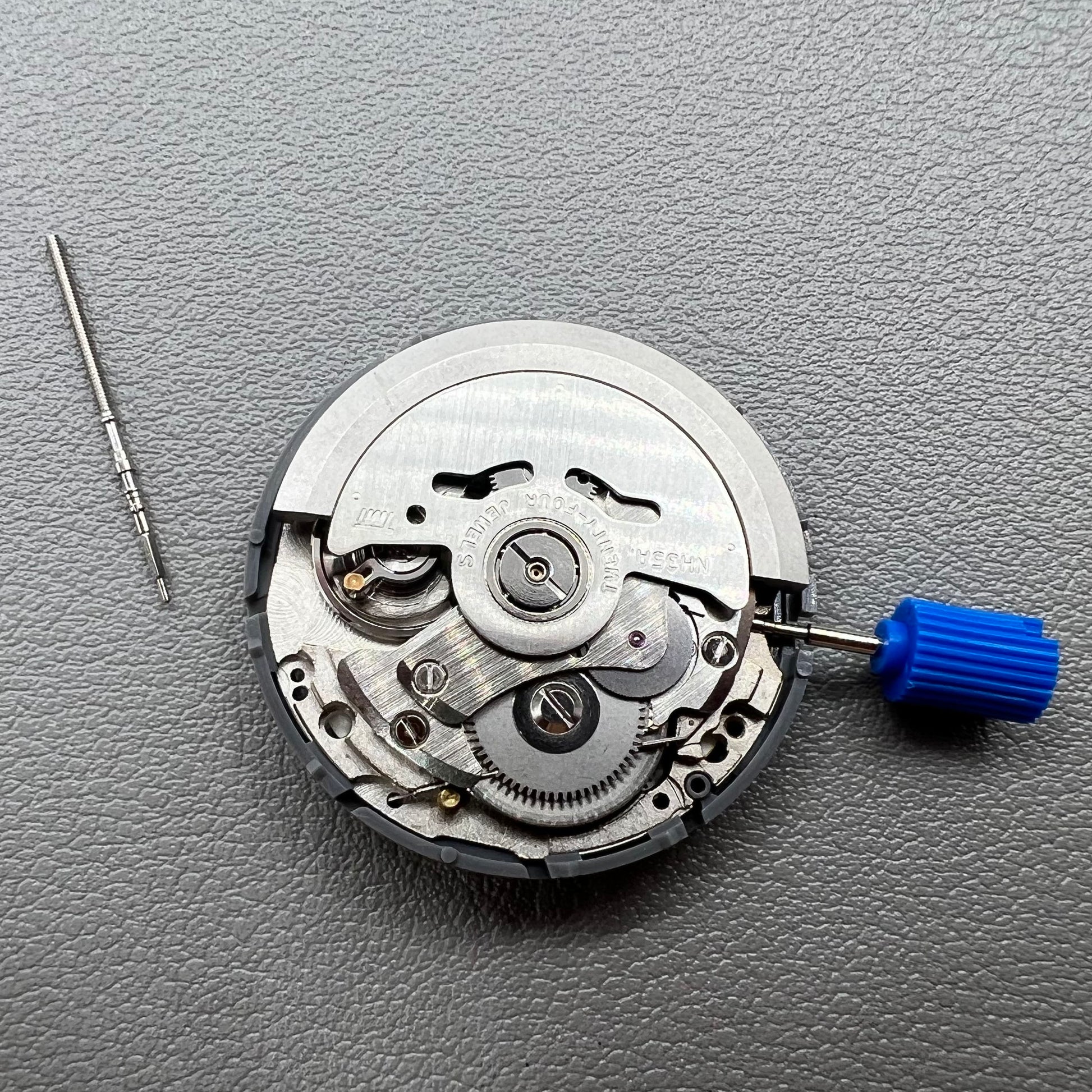 Seiko NH35 automatic watch movement with dark yellow disk, precise mechanical timekeeping by Japan.