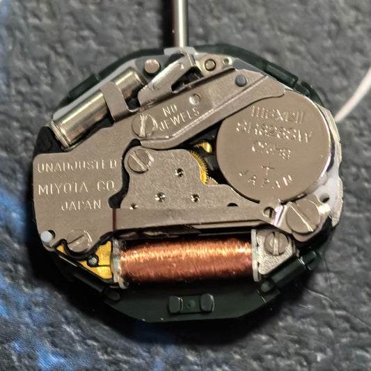 Japan-made Miyota 2005 quartz watch part with double calendar and moon phase for precise timekeeping.