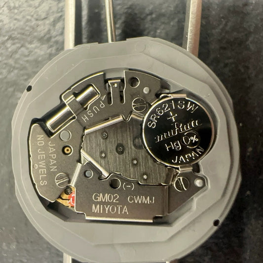 Japan-made Miyota GM02 quartz watch movement with date display at 6 o'clock, precision timekeeping.