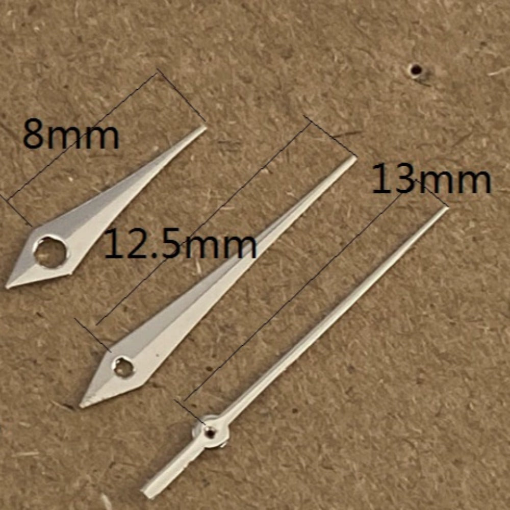 Silver 13mm arrow-shaped watch hands with no lume, compatible with Ronda 515 quartz,.