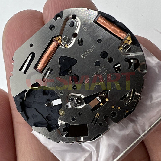 Hattori VR32 Japan quartz chronograph watch movement showing intricate gears and precision components.