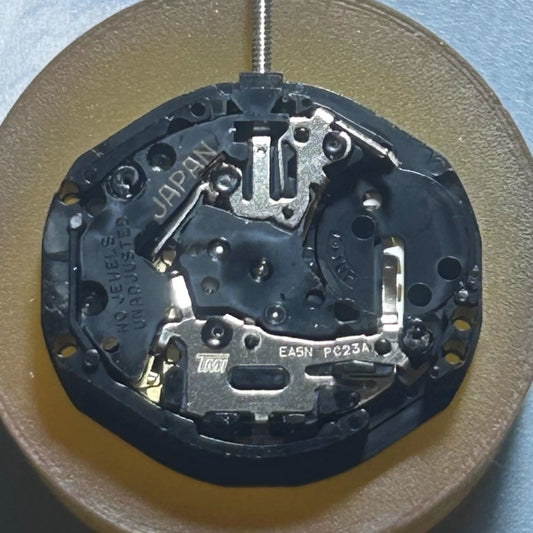 Japan Made TMI PC23A quartz watch movement with 3 hands and double calendar English disk for accurate timekeeping.