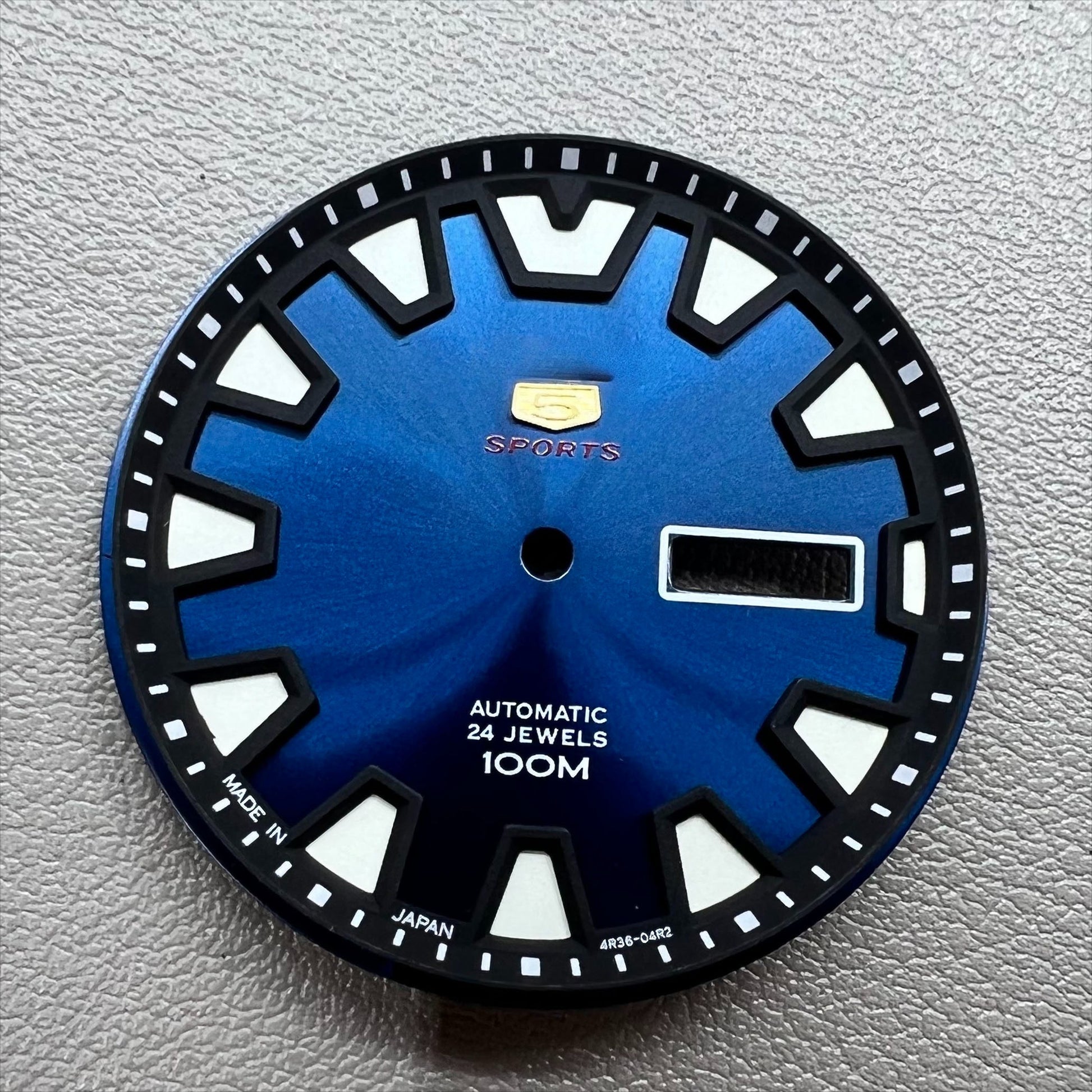 35mm green luminous watch dial with blue accents for NH36 movement, designed for easy readability in low light.