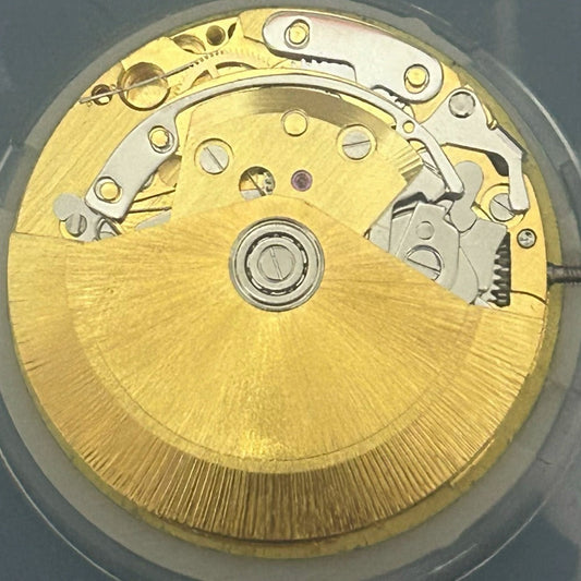 China Made Golden Dandong 7750 watch movement with small seconds at 3, 6, and 9 o?clock positions.