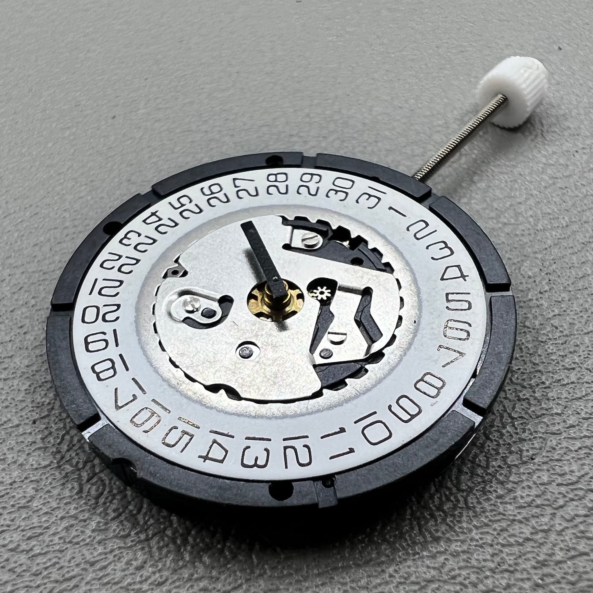 Swiss ISA 2320 watch accessory with white dial, quartz movement, date display at 3 o'clock by Swiss brand.