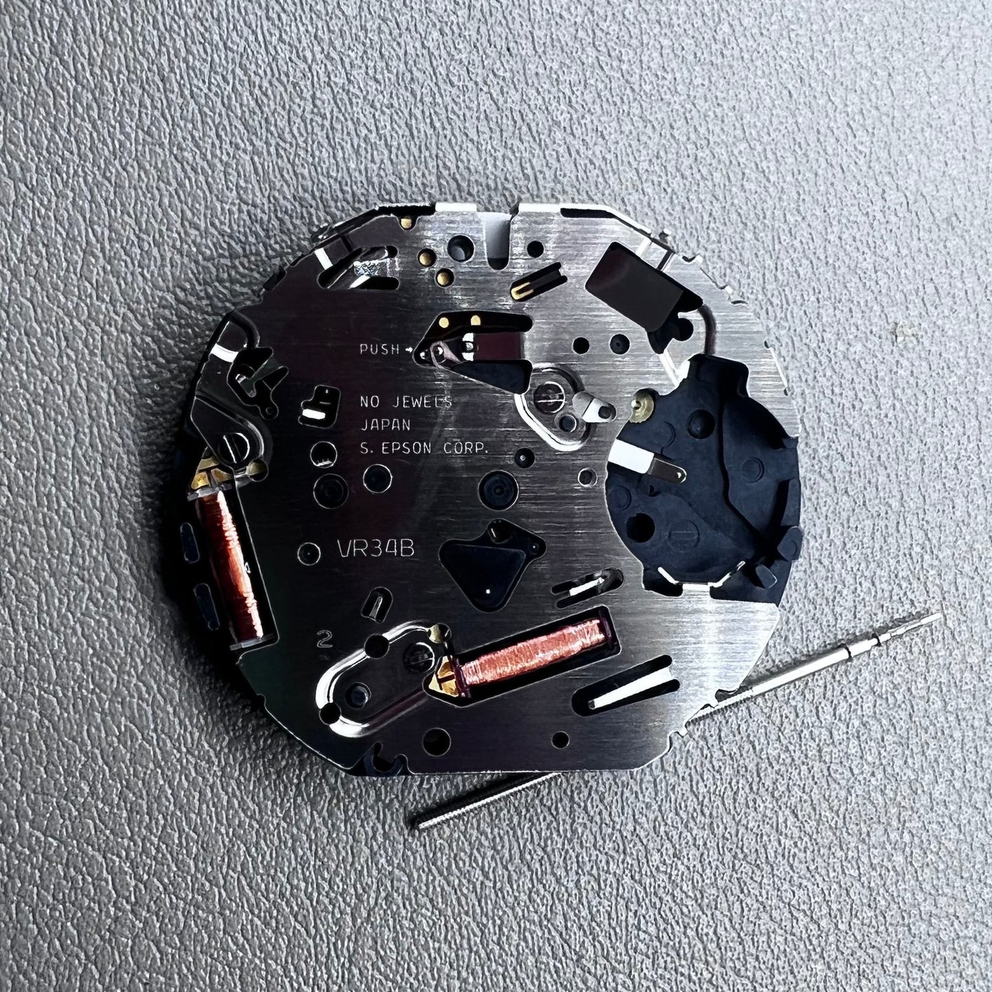 Japan Hattori Epson TMI VR34 quartz watch movement for precise timekeeping in accessories.