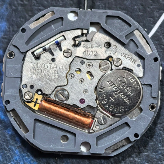 Miyota 4U12 quartz watch movement with single calendar date at 6, Japan made precision.