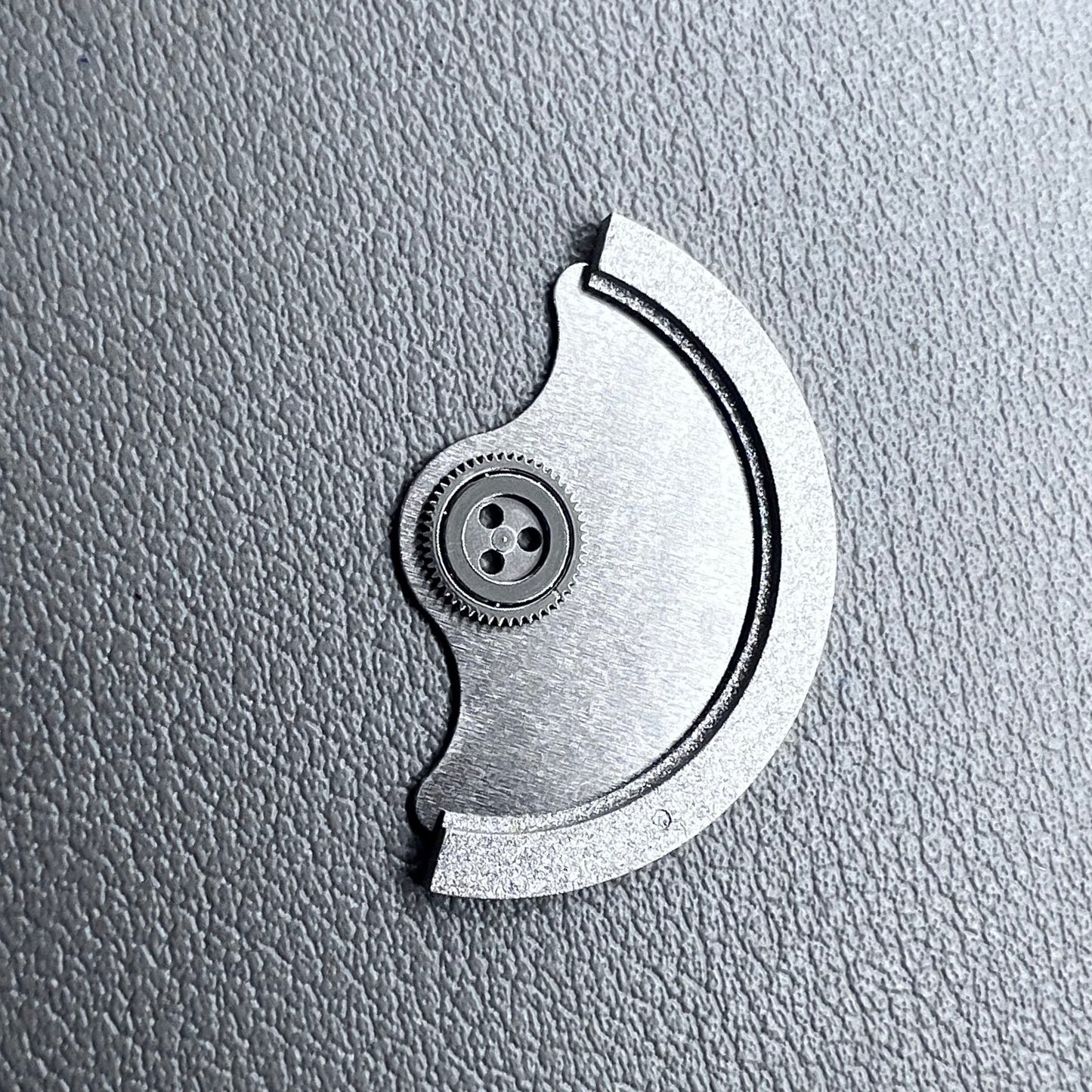 Silver rotor oscillating weight for Miyota 9015 mechanical watch movement, enhancing winding efficiency.