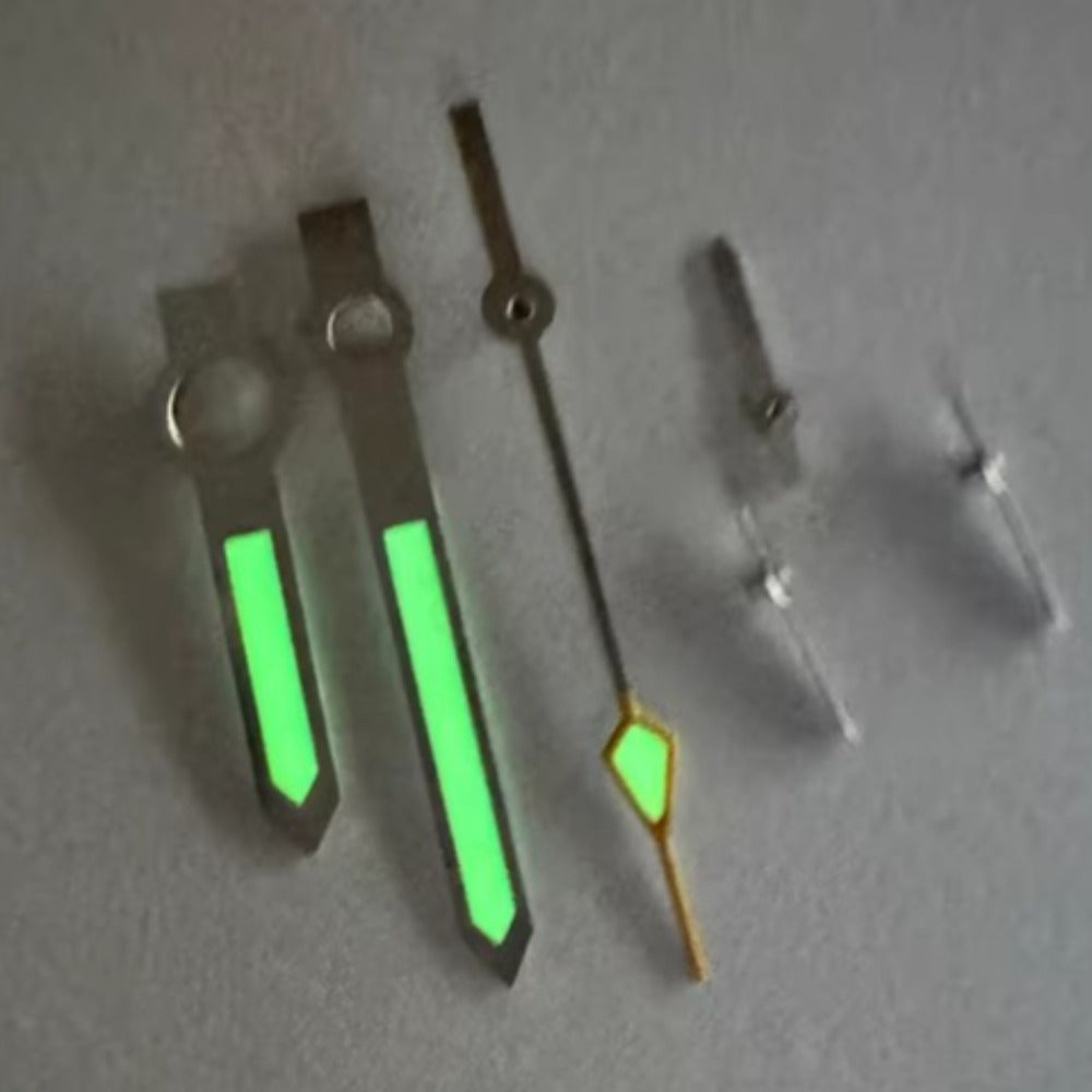 Silver and orange C3 green lume watch hands for Breitling 7754 movement, enhancing readability and style.