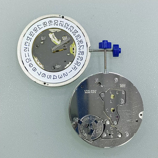 Swiss Part Ronda 5021.D quartz watch movement with date display at 4 o'clock on white dial