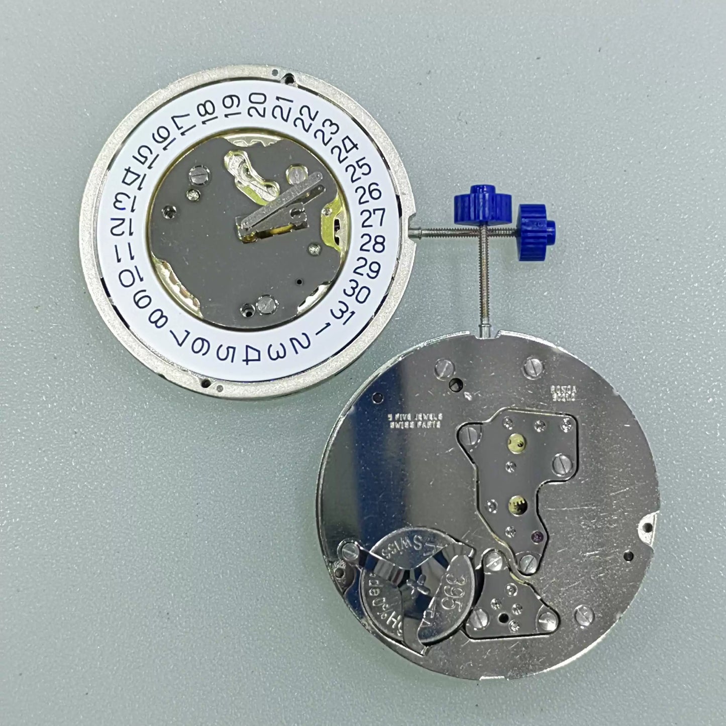 Swiss Part Ronda 5021.D quartz movement with date window at 4 o'clock, white dial disk.