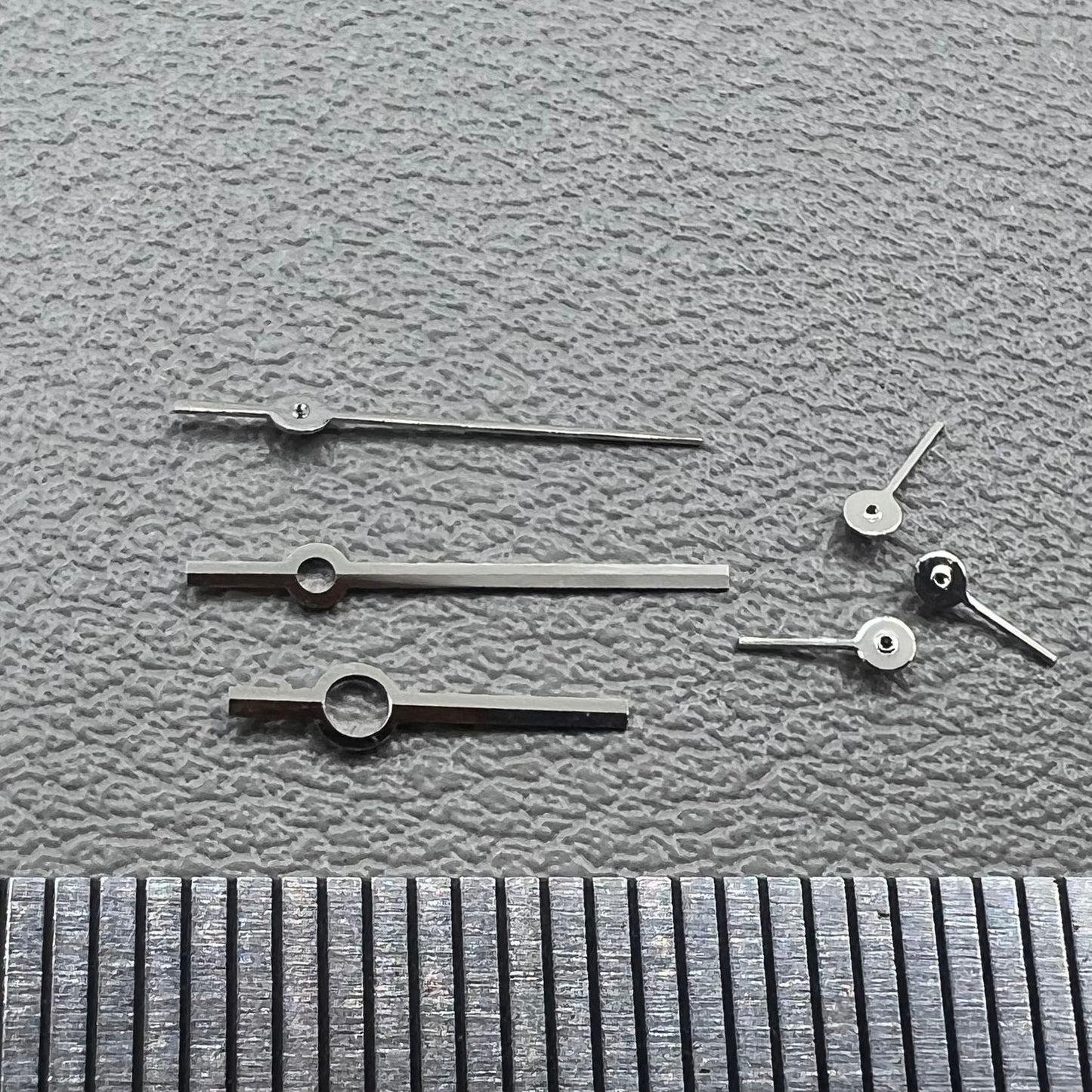 Silver watch hands set for Ronda 5030.D quartz movement, precision timepiece parts.