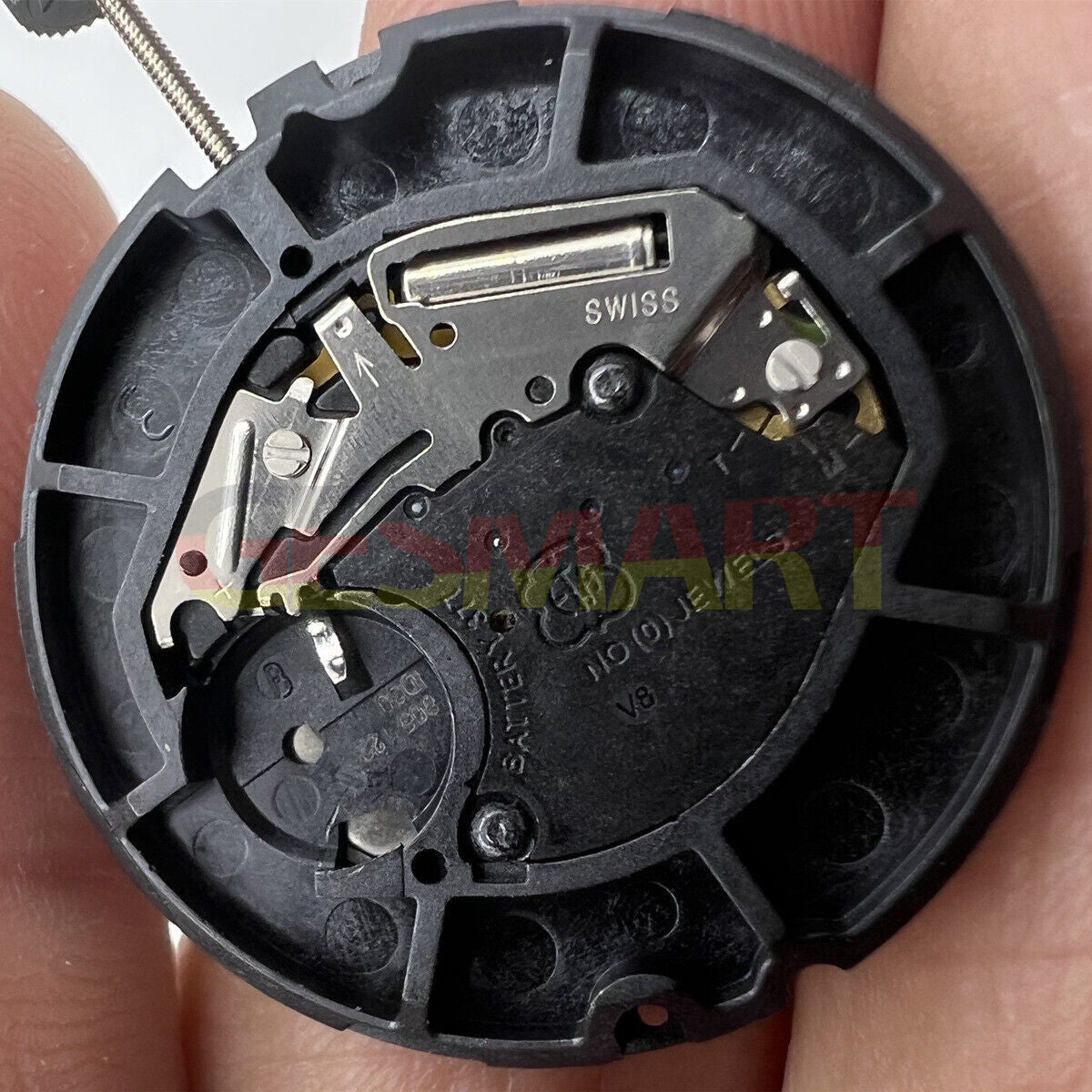 ETA 805.122 Swiss quartz watch movement showing three hands with day and date display for accurate timekeeping.