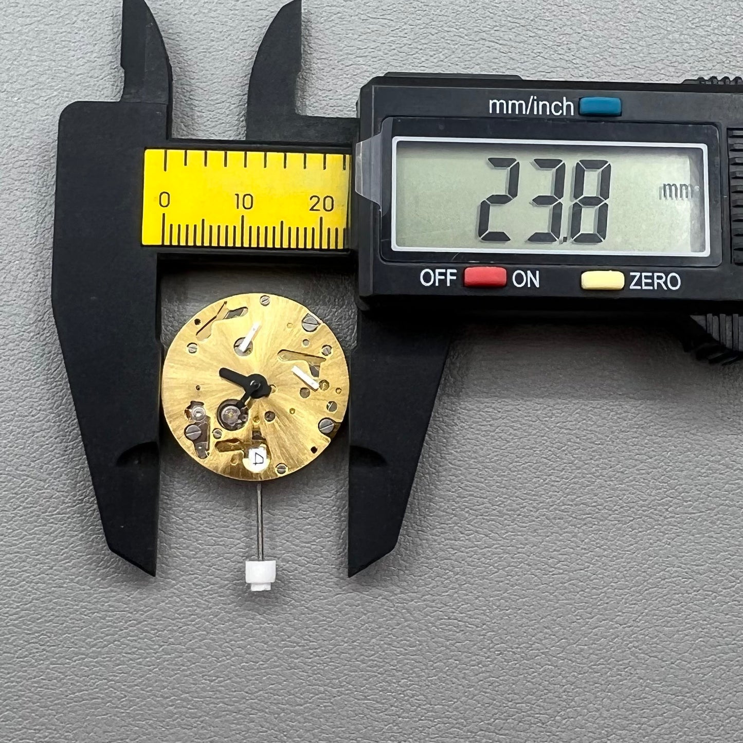 Swiss ISA 9232 quartz watch movement with six hands, date at 3, small seconds at 6/9/12, precision timekeeping.