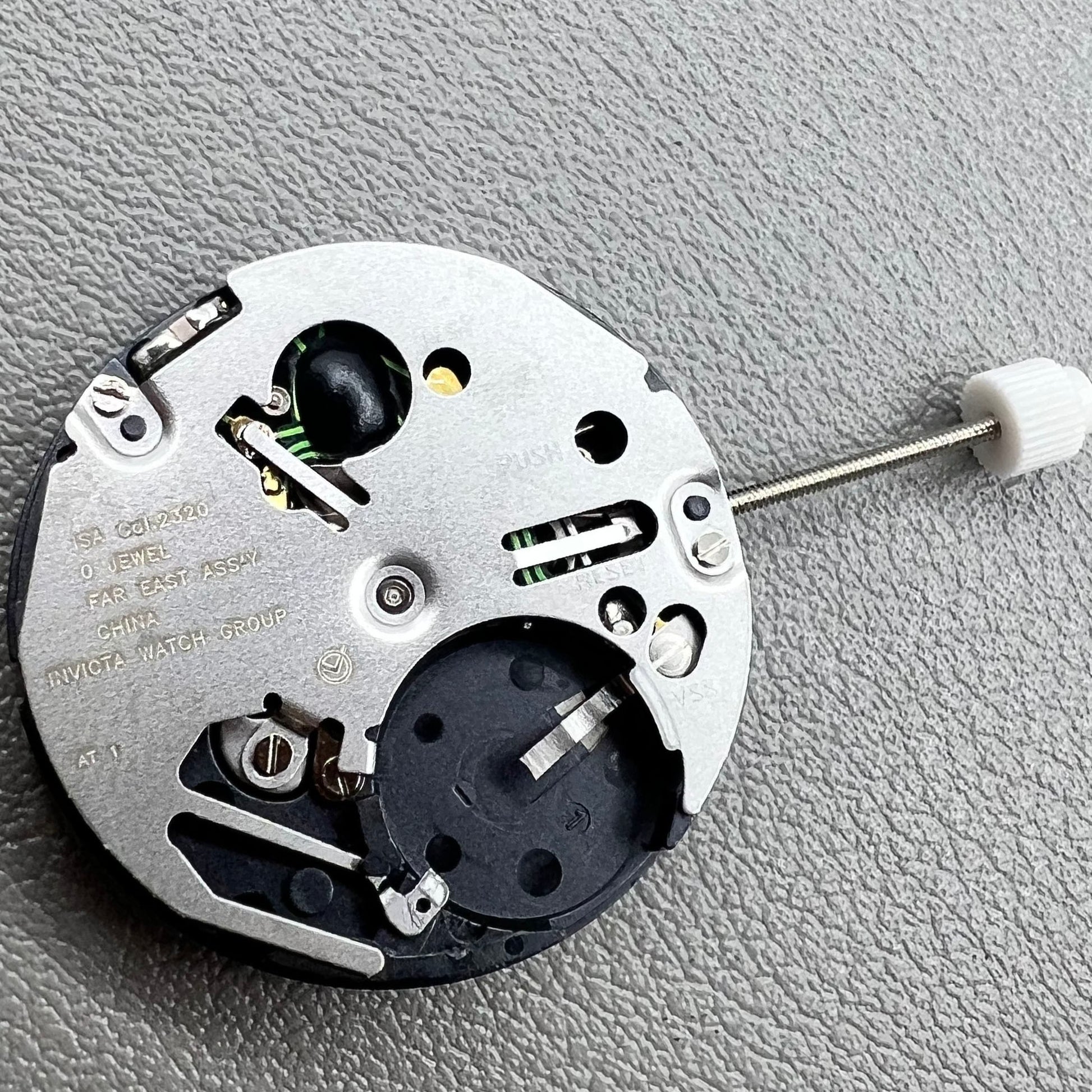 Swiss ISA 2320 watch accessory with white dial, quartz movement, date display at 3 o'clock by Swiss brand.