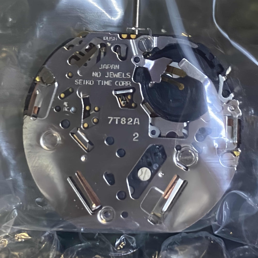 Seiko 7T82A quartz watch movement with single calendar and black date disk at 6 o'clock.
