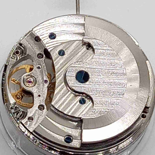 Silver big flywheel watch with mechanical movement and moonphase at 3 o'clock by China Made.