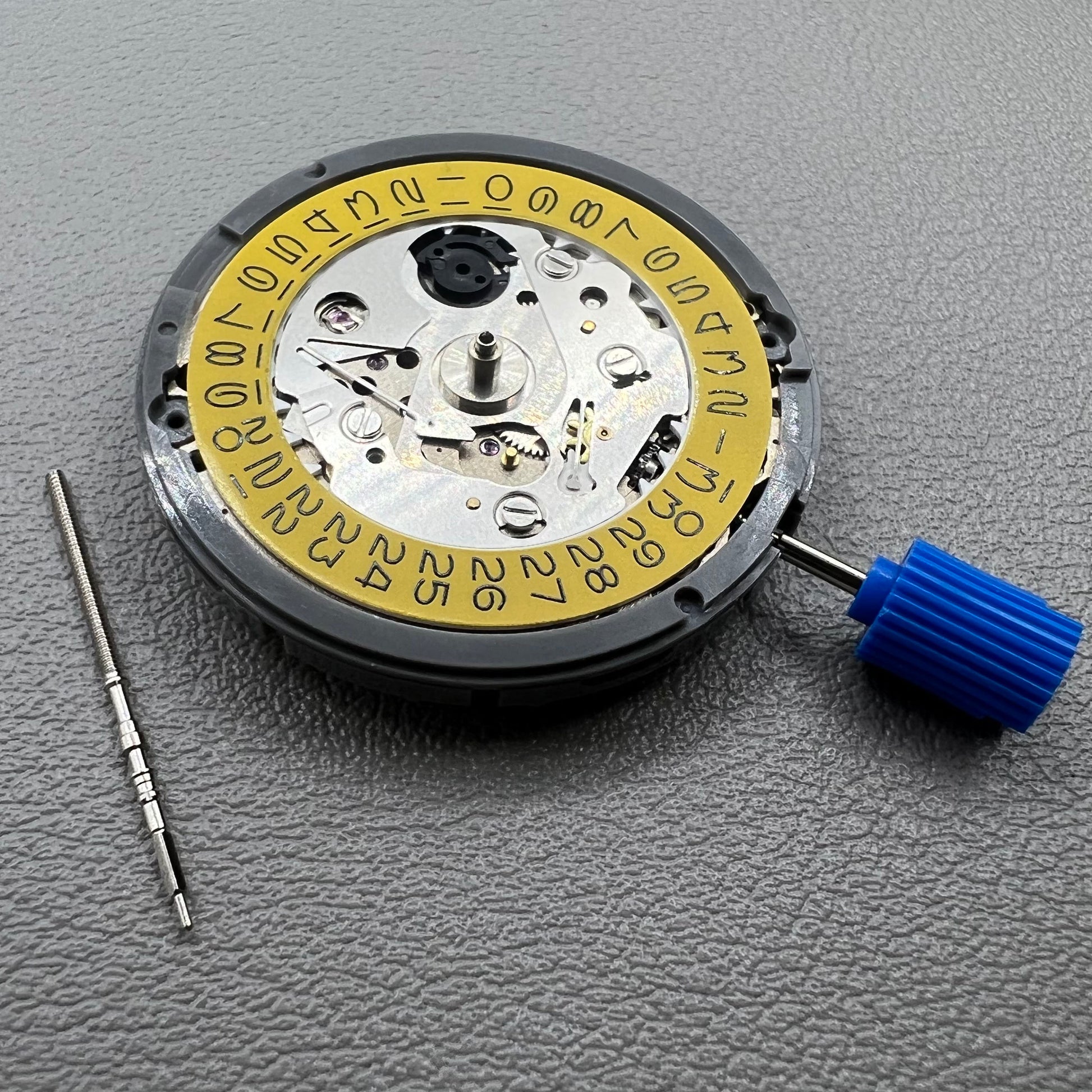 Seiko NH35 automatic watch movement with dark yellow disk, precise mechanical timekeeping by Japan.