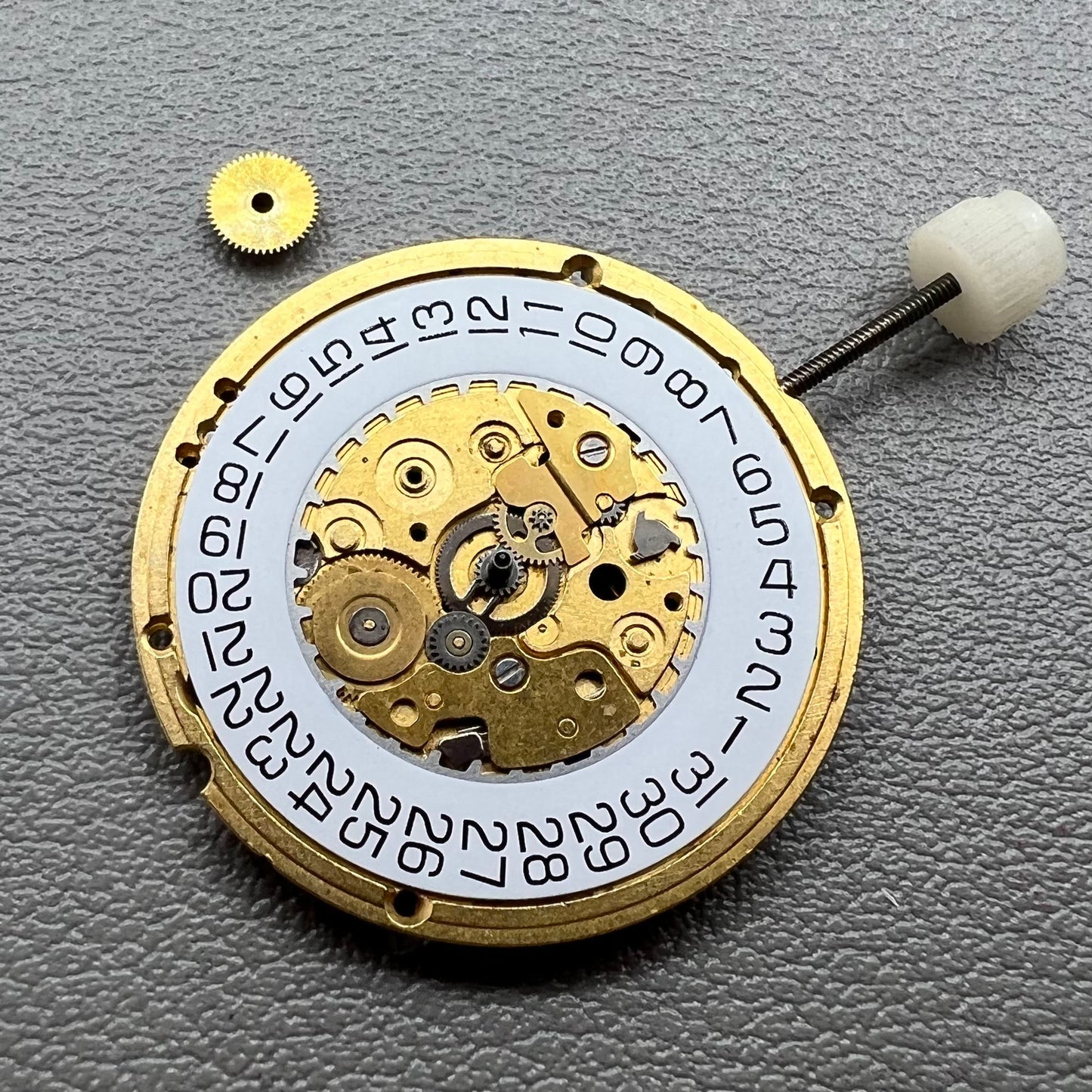 Swiss ETA255.412 quartz watch movement with 3 hands and white dial, precision craftsmanship by ETA.
