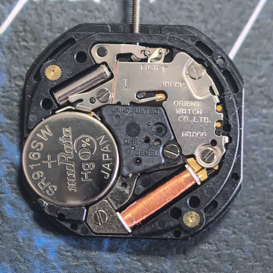 Orient Japan-made H4A00 quartz watch with small second subdials at 2, 6, and 10 o'clock positions.