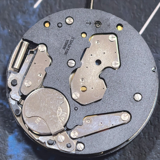 Japan Made White Ronda Z50 quartz watch movement with 5 hands and small seconds at 3/9, ideal for precise repairs.