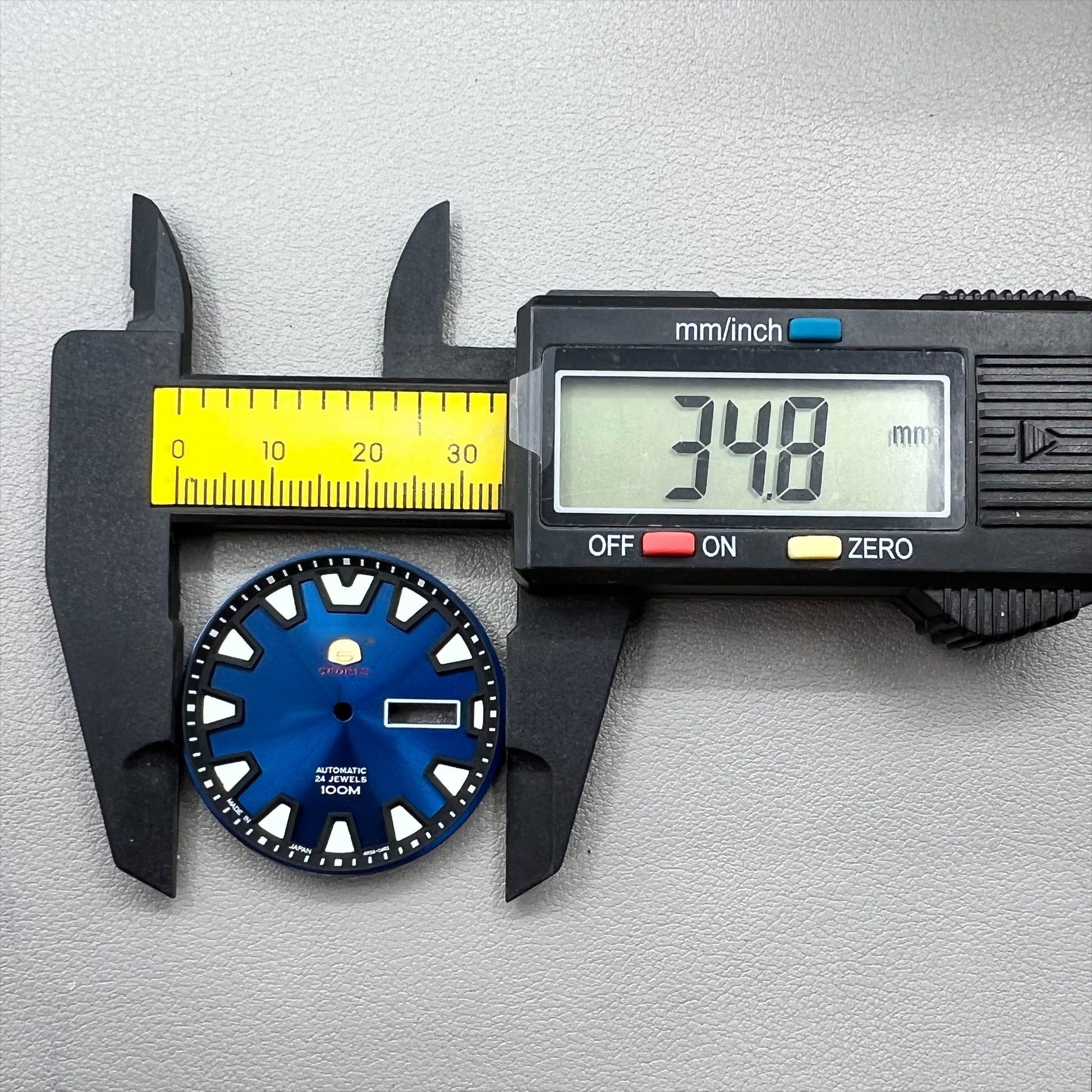 35mm green luminous watch dial with blue accents for NH36 movement, designed for easy readability in low light.