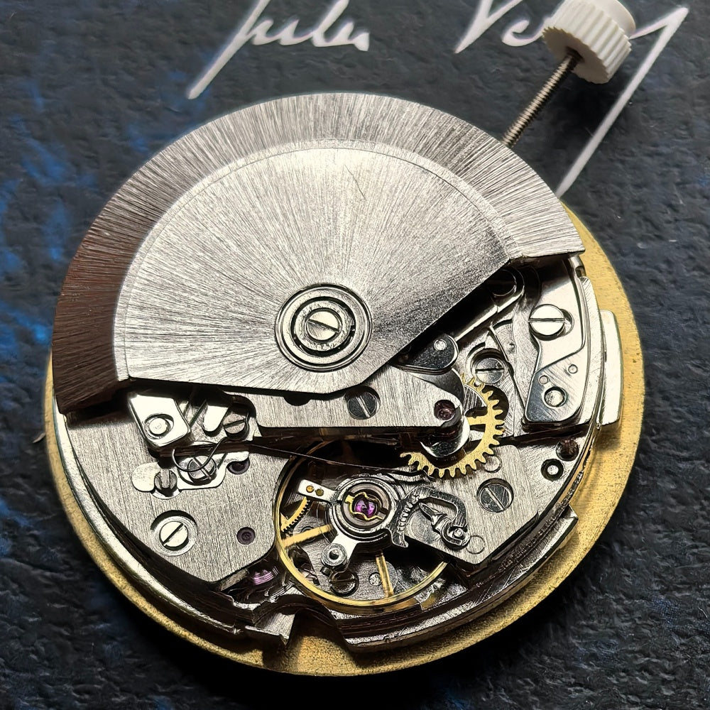 Chinese Dandong 7750 mechanical watch movement displaying big date at 12 and small seconds at 4/8 positions.