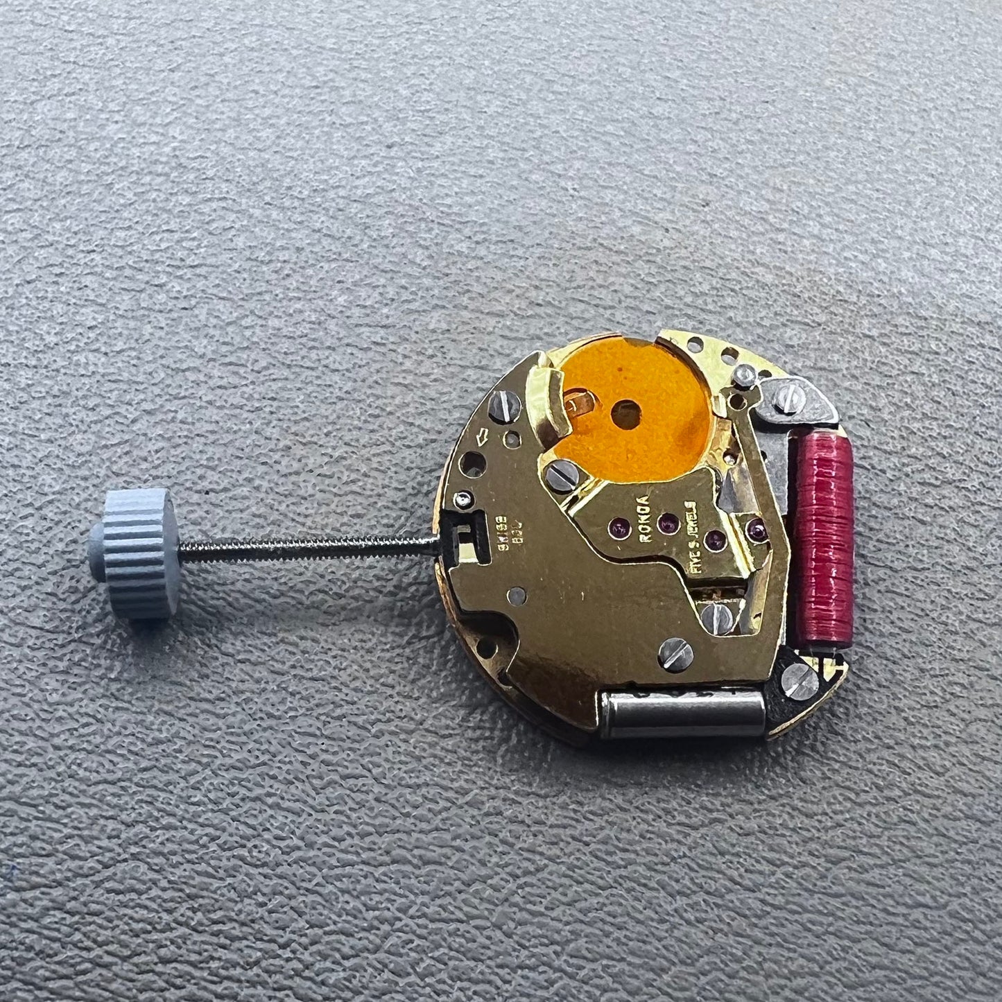 Swiss Ronda 775 quartz watch part with white date disk at 6 o'clock, ideal for precise repairs.